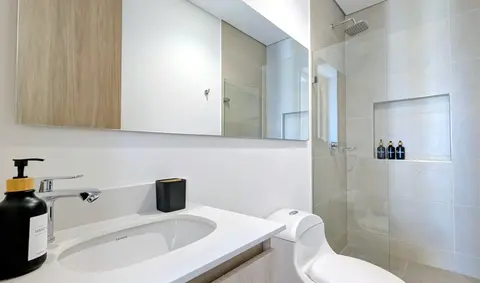 Clean, stylish guest bathroom fully stocked.