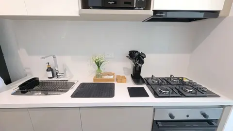 Contemporary kitchen fully loaded for gourmet cooking.