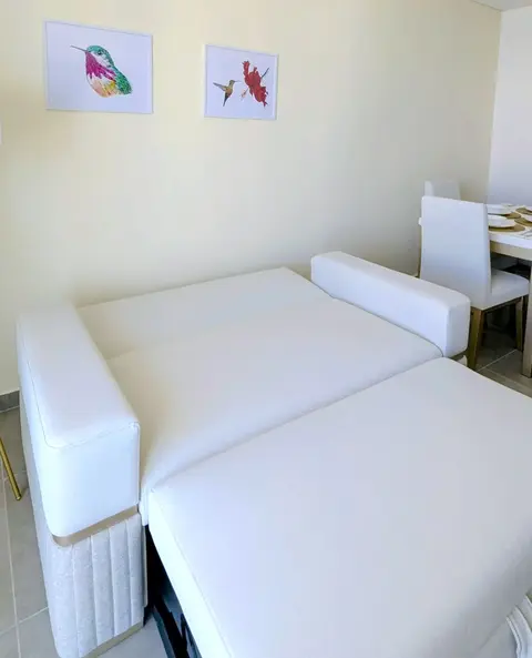 Convenient pull-out sleeper couch expanding guest capacity.